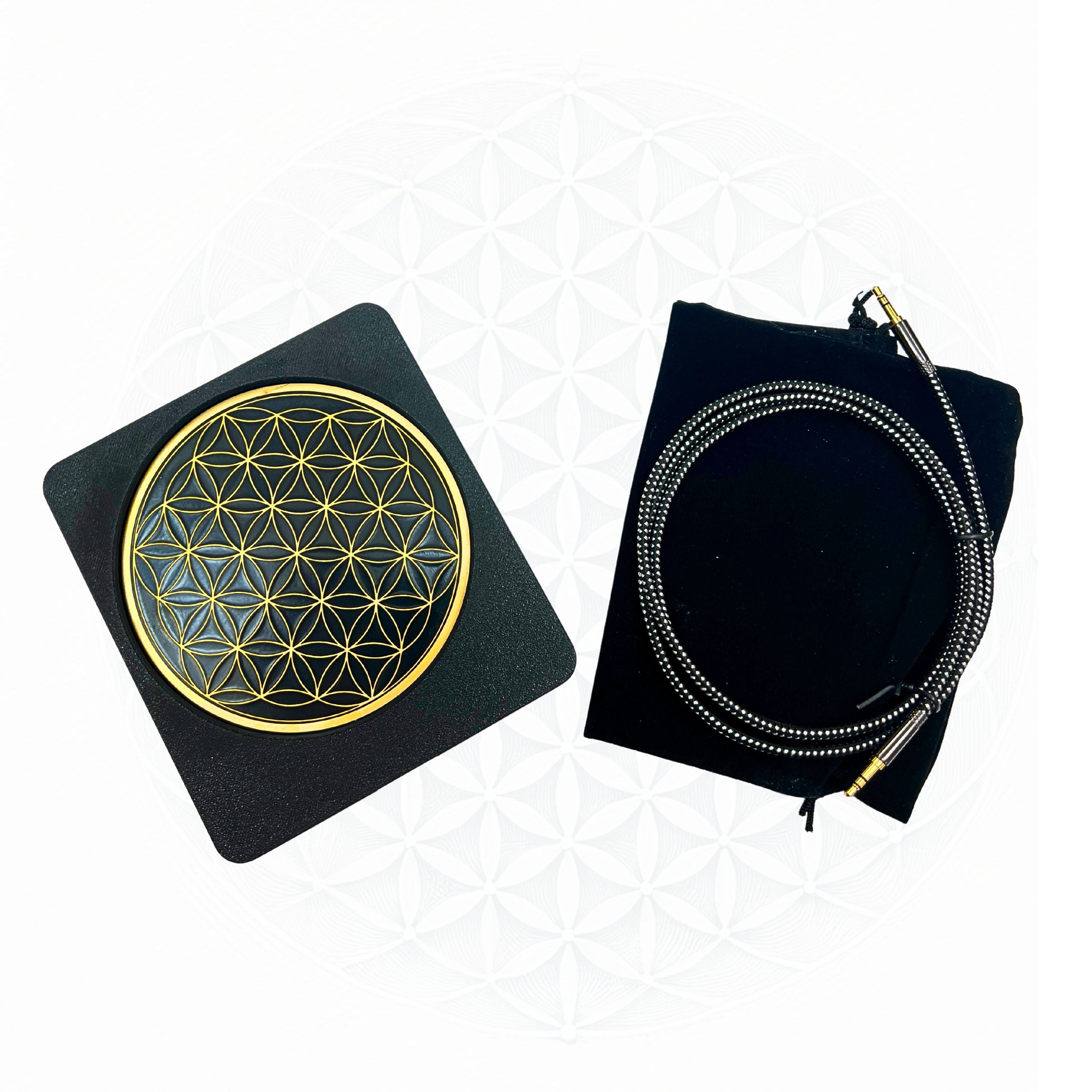 Metatronic Flower of Life Frequency Imprinter by Sacred Ritual Oils with intricate gold design and connecting cable